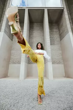 woman yellow suits building fashion