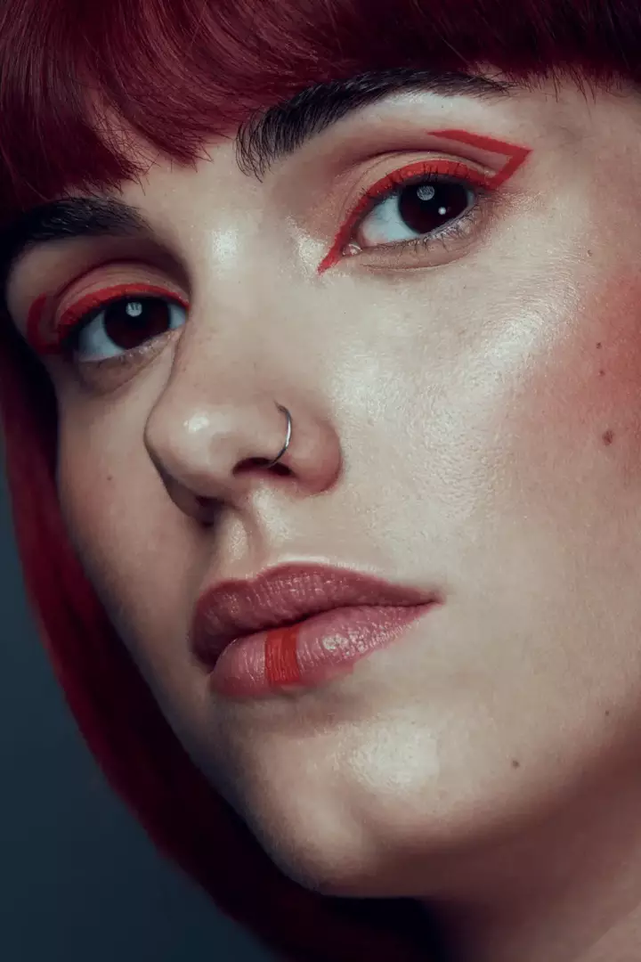 woman red stripes makeup closeup