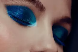 woman blue makeup glitter smokey